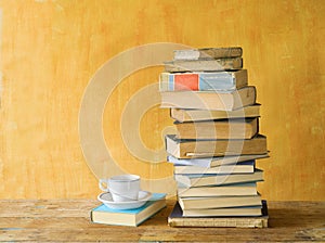 Stack of books, with a cup of coffee