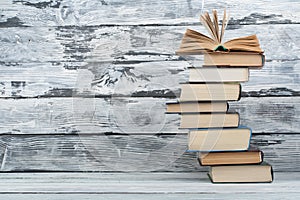 Stack of books. Education background. Back to school. Book, hardback colorful books on wooden table. Education business