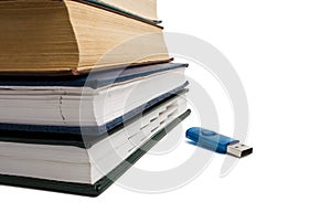 Stack of books and flash drive
