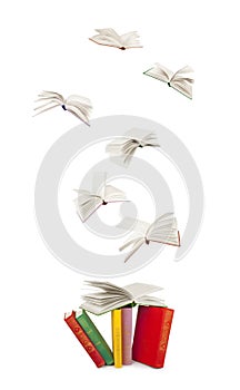 Stack of books and flying books