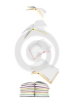 Stack of books and flying books