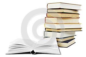 Stack of books in hard cover and one opened book