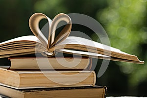 Stack of books with heart shape