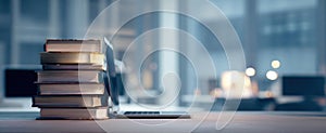 The stack of books beside a laptop in a serene modern workspace..AI generated image