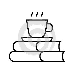 Stack of books and mug. Coffee cup on stack of books isolated white background