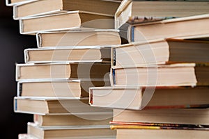 A stack of books in multicolored covers in the library or bookstore