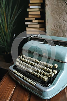 Stack of books and old typewriter