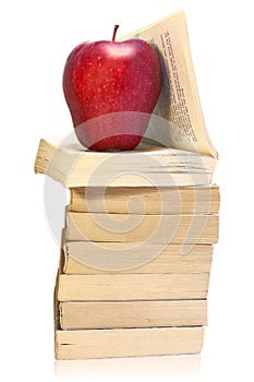 Stack of books with red apple