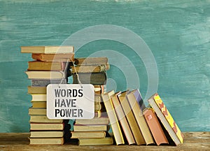 Stack of books and saying Words have power, education reading,learning concept