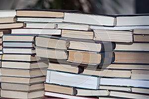 Stack of books is stacked in chaotic manner