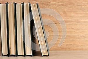 Stack of books on wooden background