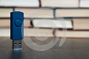 Stack books on wooden background. USB