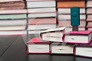 Stack books on wooden background. USB