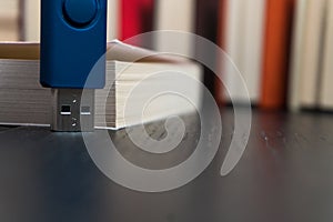 Stack books on wooden background. USB