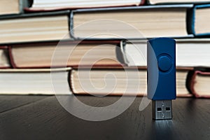 Stack books on wooden background. USB