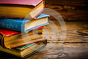 Stack of Books on Wooden Table. Generative AI