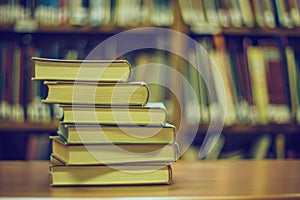 Stack of Books on Wooden Table
