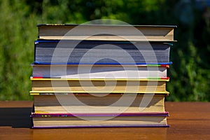 Stack of the books on wooden table