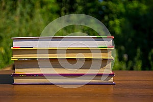 Stack of the books on wooden table