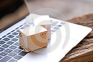 Stack boxes on laptop Idea of shopping online and service