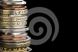 Stack of British Coins over Black