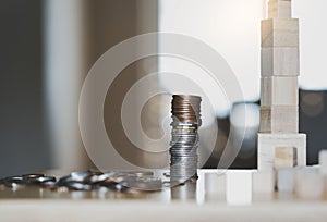 Stack British money sterling pound coins on wooden table, Selective focus GBP coins on the table with blurry bokeh light in dark