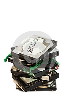 Stack of broken hard disk drives. Isolated