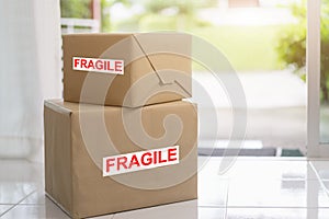 Stack of brown cardboard boxes, fragile box, Fast and reliable service. Delivery and packing concept photo