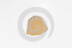A Stack of Brown Cardboard Tags on White Isolated Background