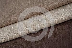 Stack of brown linen fabrics, close up