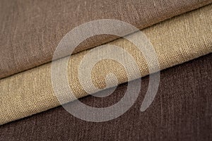 Stack of brown linen fabrics, close up