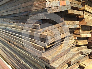 A stack of brown ply wood photo