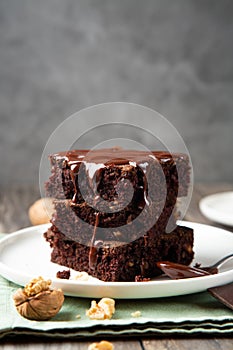 Stack of brownies with melted chocolate