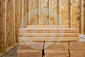 Stack of building lumber in construction site