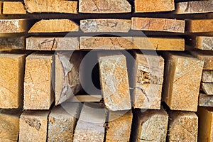 Stack of building lumber at construction site with narrow depth