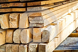 Stack of building lumber at construction site with narrow depth