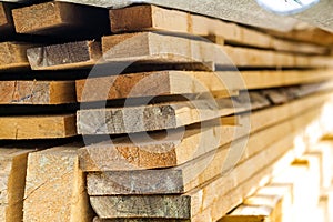 Stack of building lumber at construction site with narrow depth