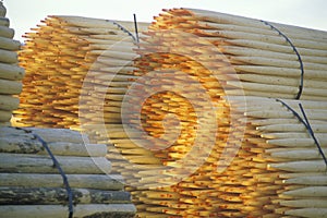 A stack of bundled fence posts