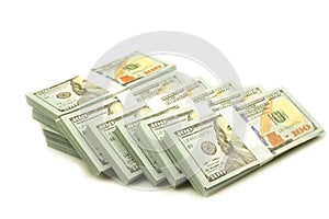 Stack bundles of 100 US dollars banknotes photo