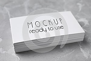 Stack of business cards with text Mockup Ready To Use on top