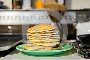Stack of buttermilk pancake on kitchen stove