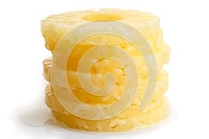 Stack of canned pineapple rings isolated.