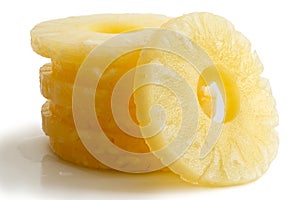 Stack of canned pineapple rings isolated.