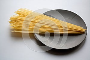 Stack of capellini pasta on plate