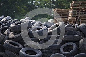 A stack of car second used car rubber tires.