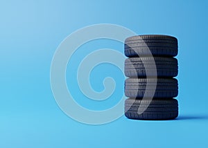 Stack of car tires on a blue background