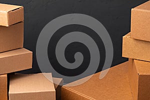 Stack of cardboard boxes against black background