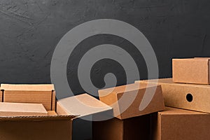 Stack of cardboard boxes against black background
