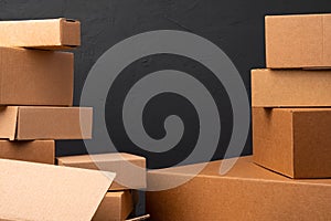 Stack of cardboard boxes against black background