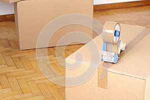 Stack of cardboard boxes in the empty room